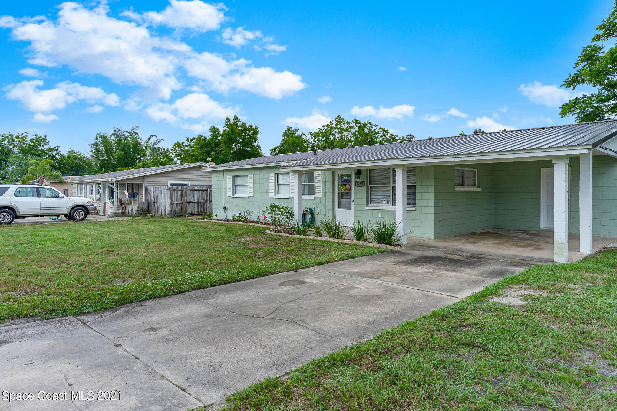 2285 Dolphin Road Titusville, FL 32780 - Photo 3 of 27 a view of house that has a yard