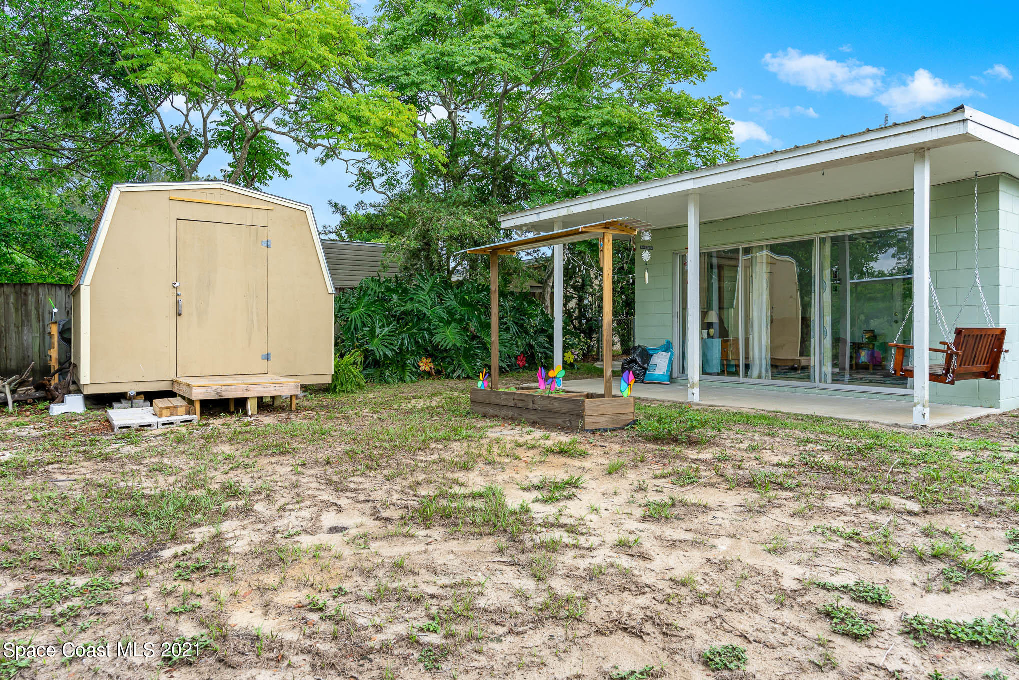 2285 Dolphin Road Titusville, FL 32780 - Photo 6 of 27 a view of a house with backyard and sitting area