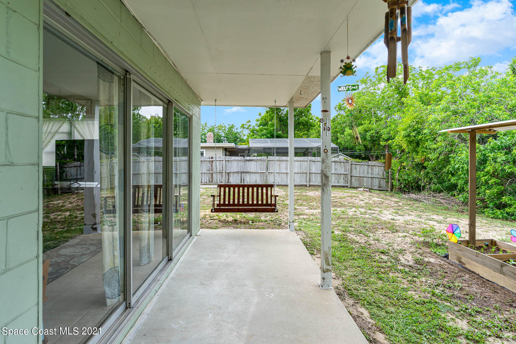2285 Dolphin Road Titusville, FL 32780 - Photo 7 of 27 a view of a backyard with porch