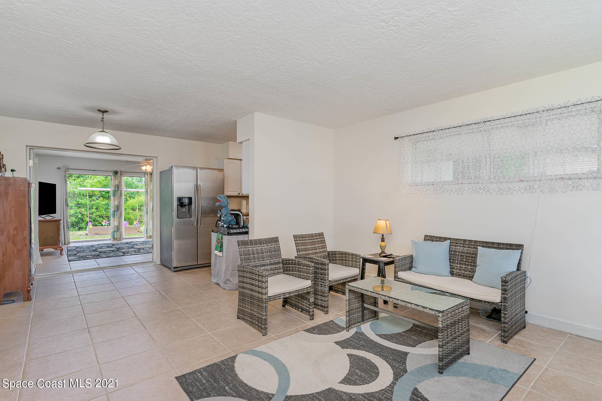 2285 Dolphin Road Titusville, FL 32780 - Photo 8 of 27 a living room with furniture and a fireplace