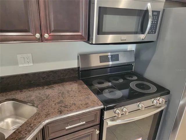 a kitchen with a stove and a microwave
