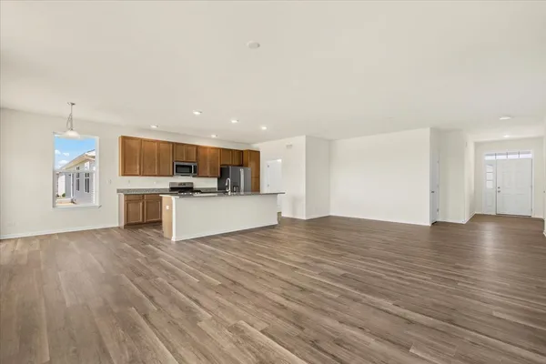 a view of a kitchen with a sink and dishwasher kitchen view with wooden floor