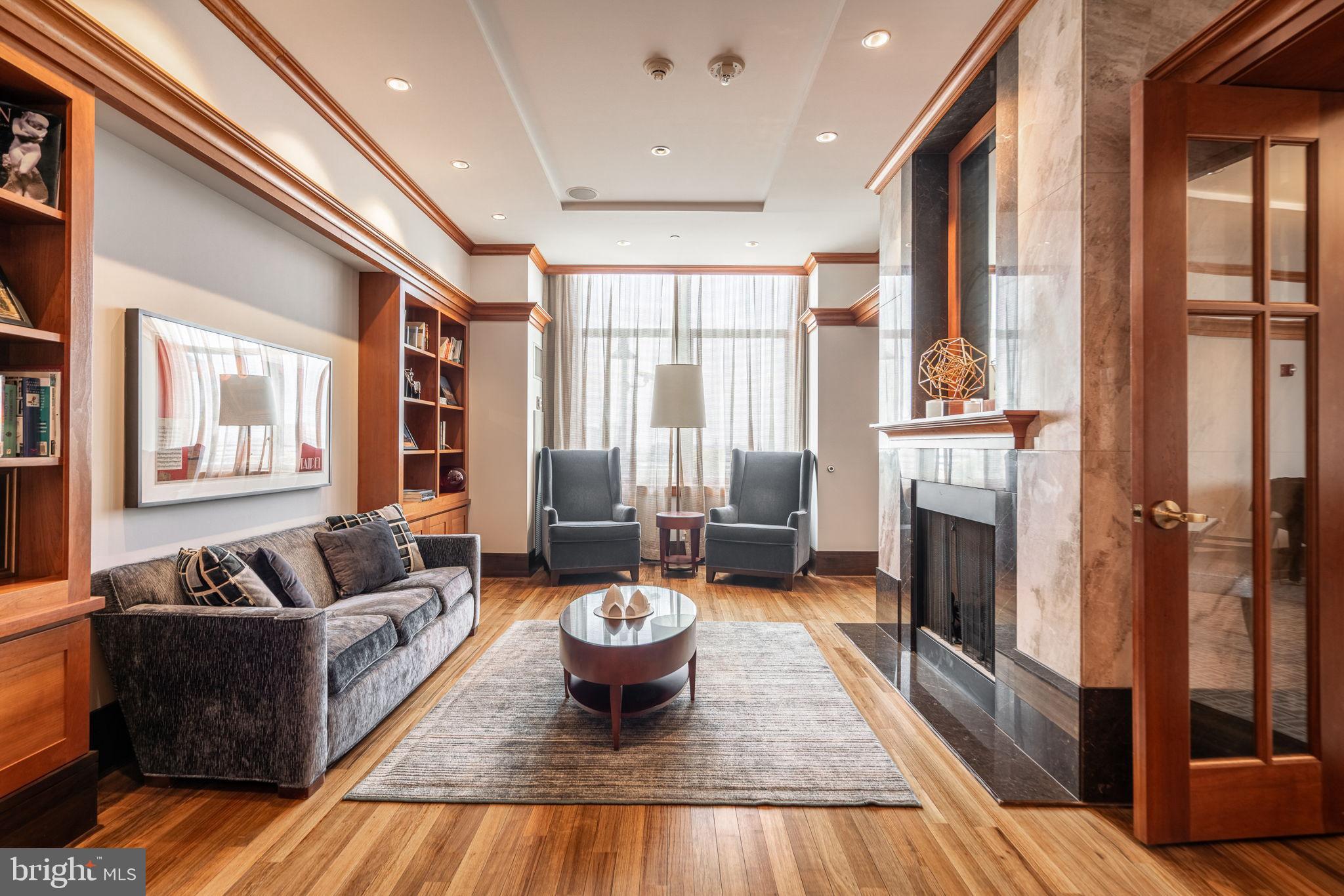 400 South Broad Street, Unit 1503 Philadelphia, PA 19146 - Photo 24 of 29 Elegant living space with warm wood accents.