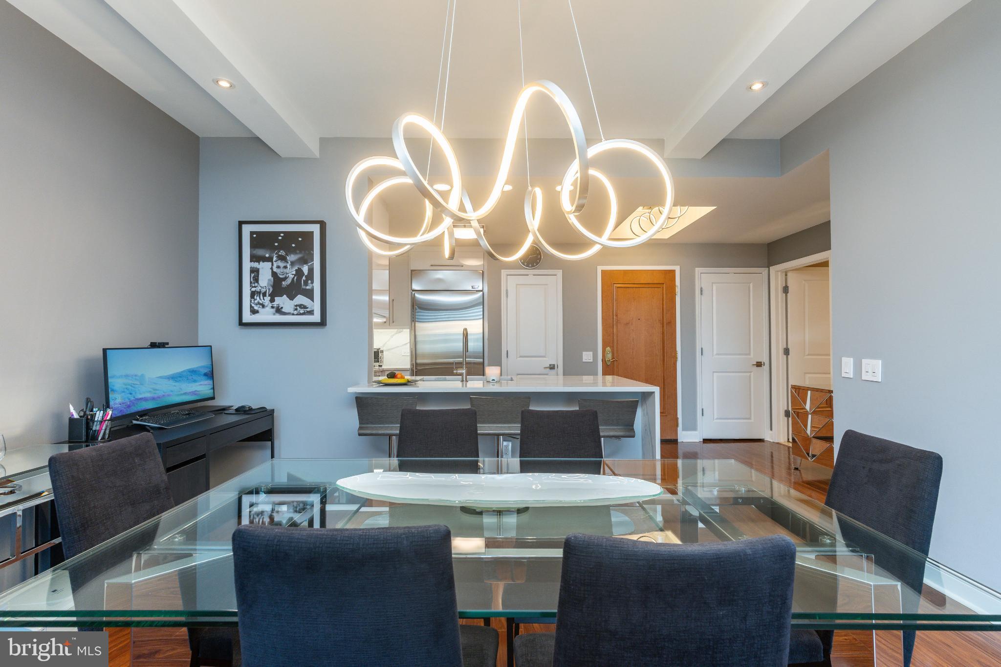 400 South Broad Street, Unit 1503 Philadelphia, PA 19146 - Photo 7 of 29 Sleek dining area with modern lighting.