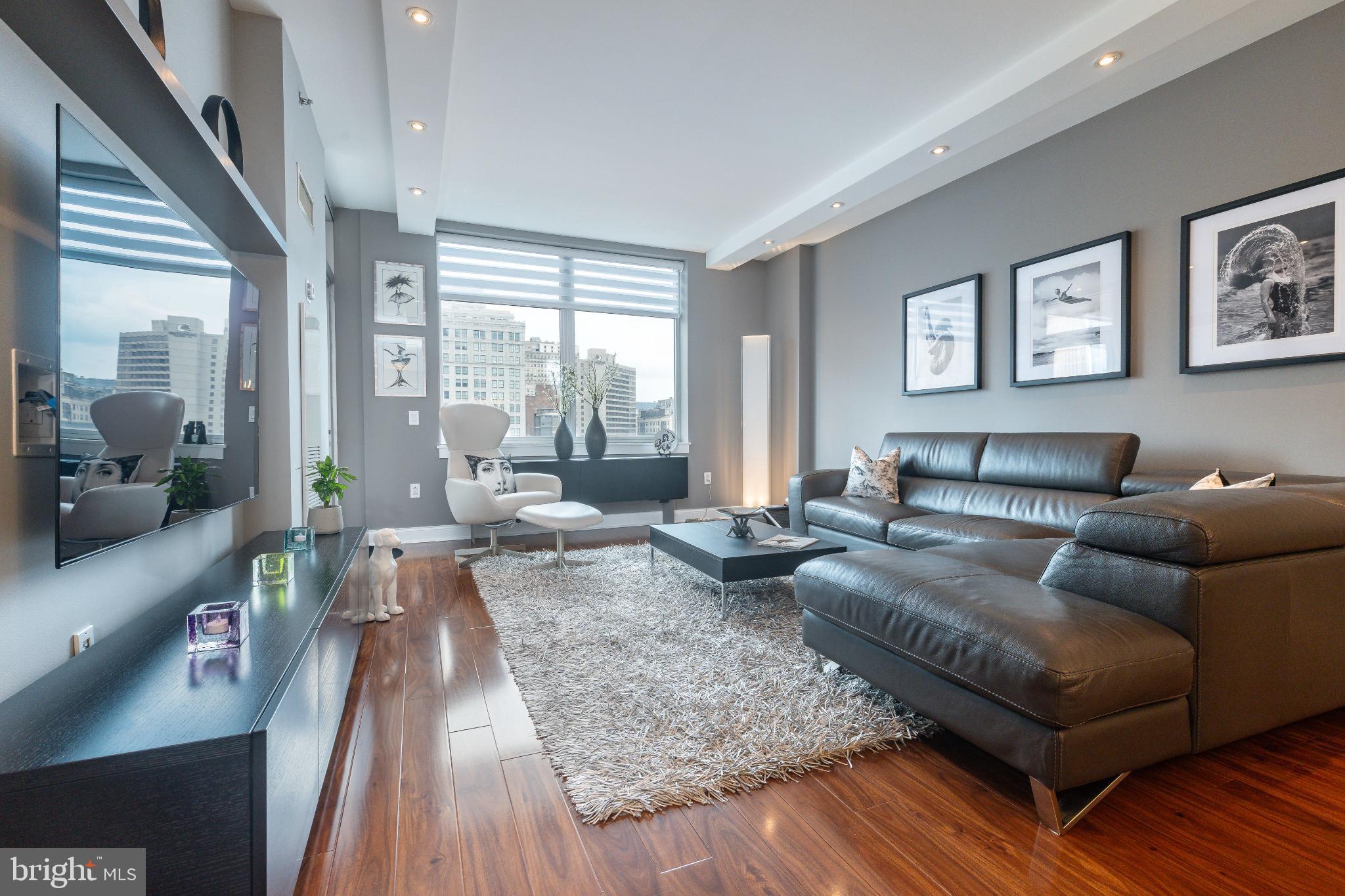 400 South Broad Street, Unit 1503 Philadelphia, PA 19146 - Photo 9 of 29 Modern elegance in a sunlit living space.