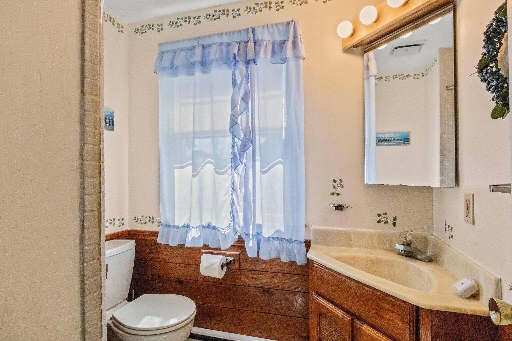 153 Long Road Harwich Port, MA 02646 - Photo 26 of 44 a bathroom with a granite countertop sink toilet and shower