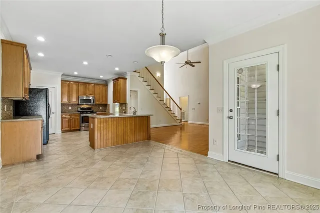 a view of kitchen with furniture and a window