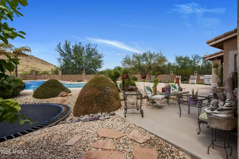 a balcony with wooden floor and outdoor seating