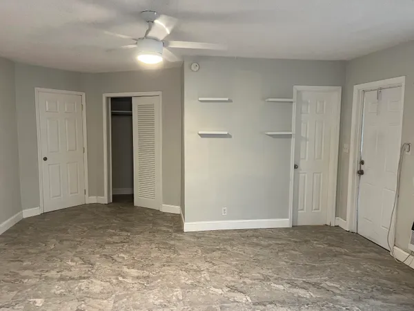 a kitchen with a refrigerator a sink and a stove
