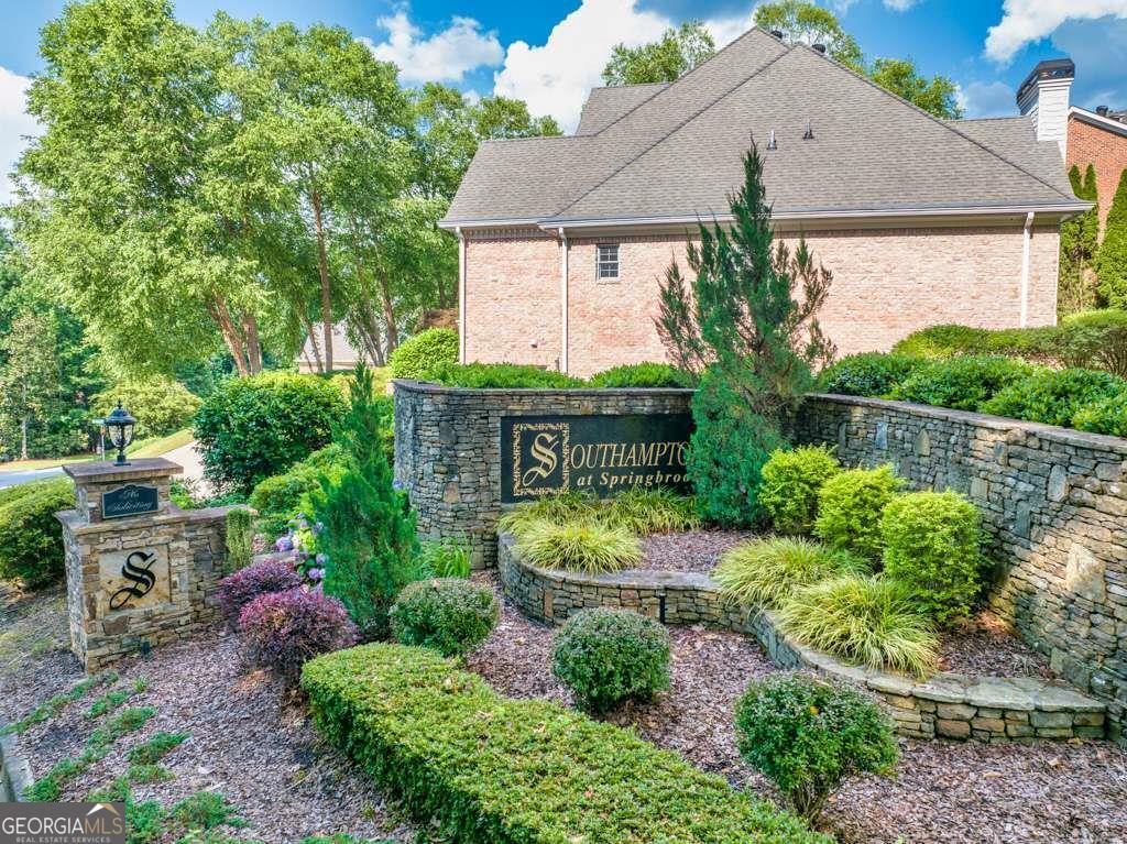 2276-2286 Lake Ridge Terrace Lawrenceville, GA 30043 - Photo 2 of 13 a front view of a house with garden
