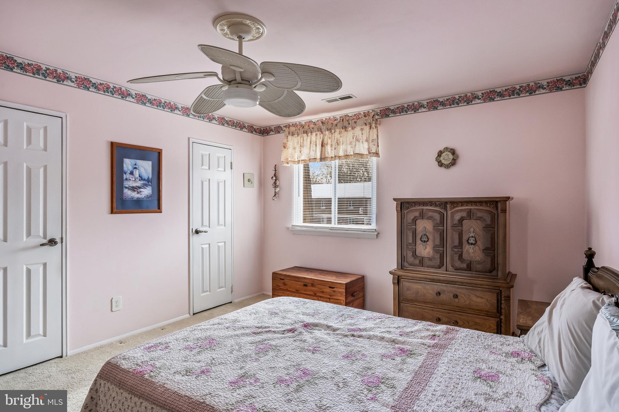 411 Stiles Avenue, Unit A2 Maple Shade, NJ 08052 - Photo 13 of 26 a bedroom with a bed and wooden floor