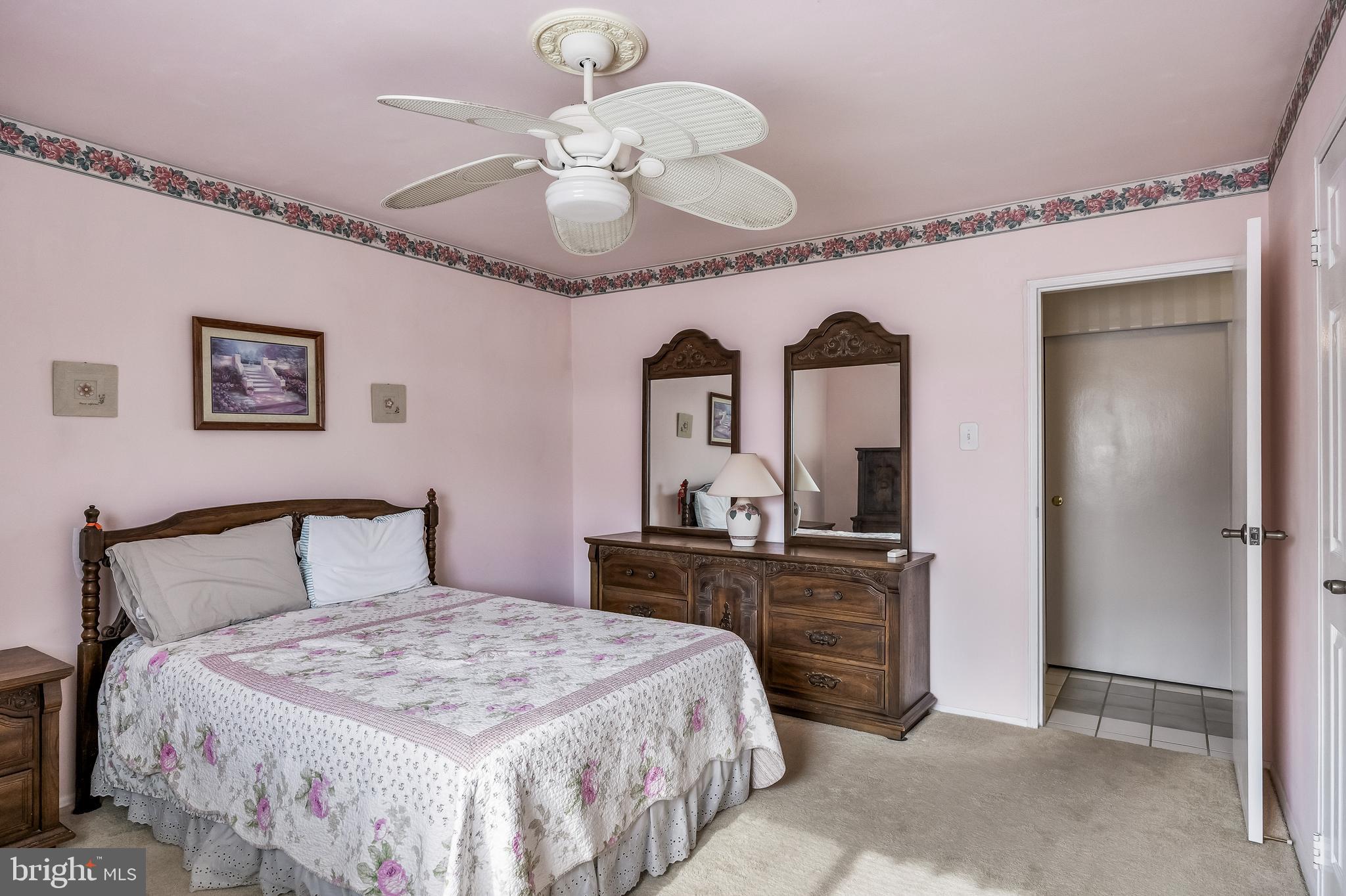 411 Stiles Avenue, Unit A2 Maple Shade, NJ 08052 - Photo 15 of 26 a bedroom with a bed and a chandelier