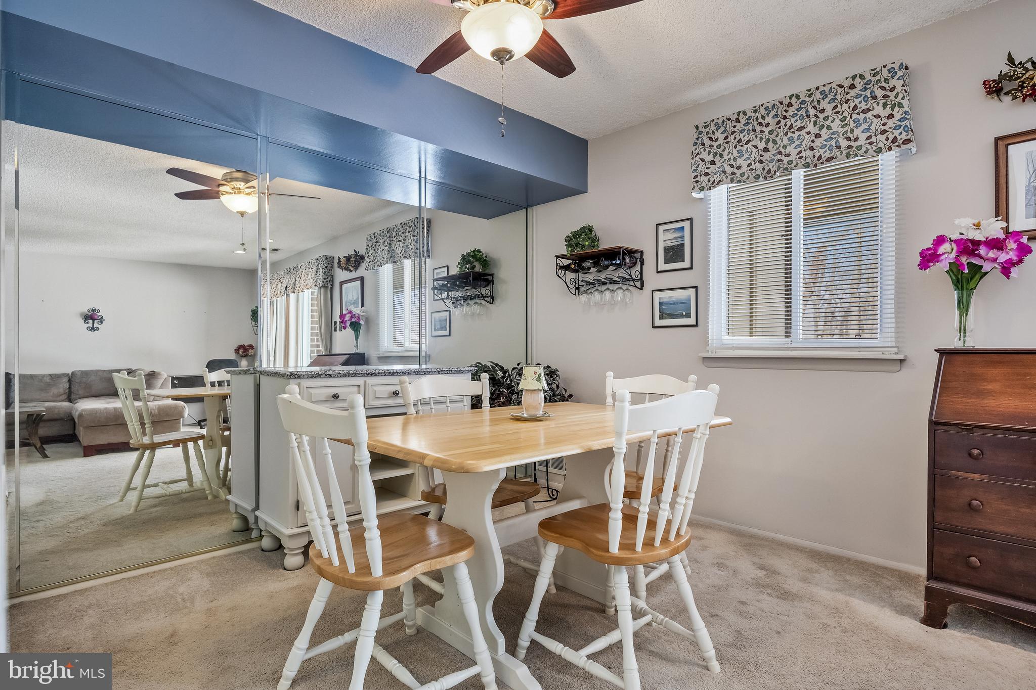 411 Stiles Avenue, Unit A2 Maple Shade, NJ 08052 - Photo 6 of 26 a view of a dining room with furniture and chandelier