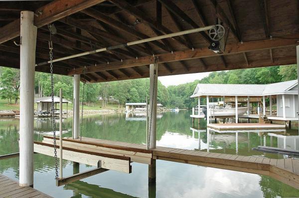 Lot 10 Jefferson Dock Road Penhook, VA 24137 - Photo 4 of 9 a view of a porch with a table and chairs under an umbrella