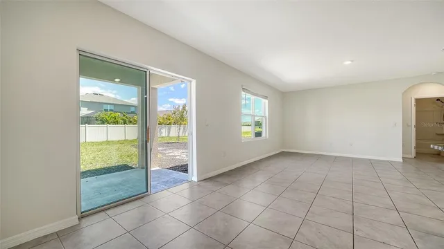 a kitchen with granite countertop a sink and a wooden floor