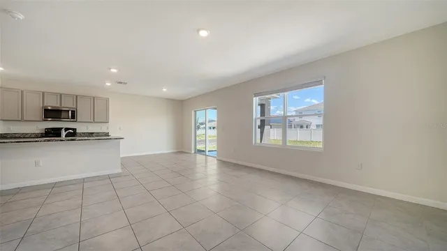 a kitchen with a refrigerator and two sink