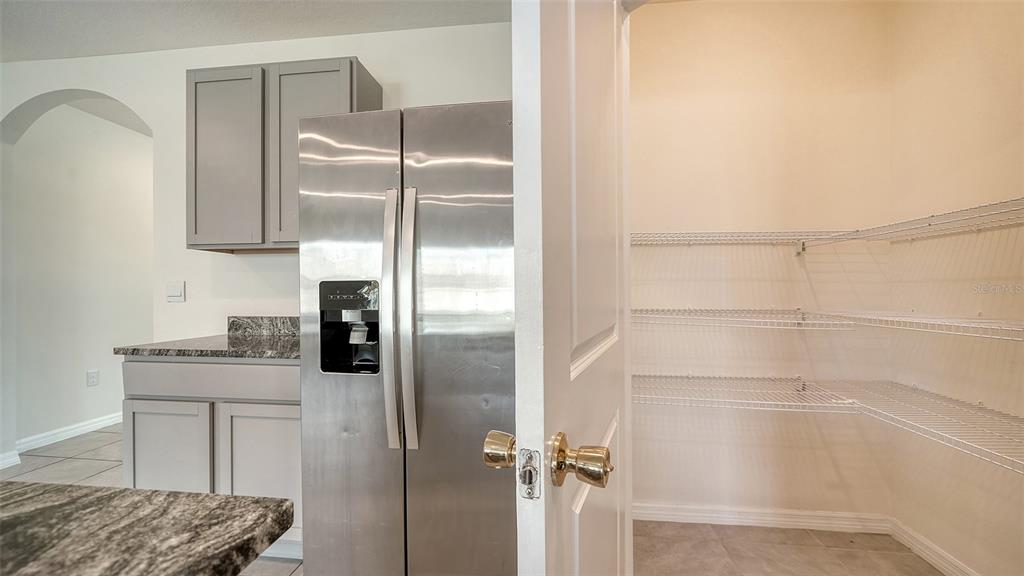 12732 Lateral Root Drive Sarasota, FL 34238 - Photo 16 of 76 a kitchen with a refrigerator and two sink