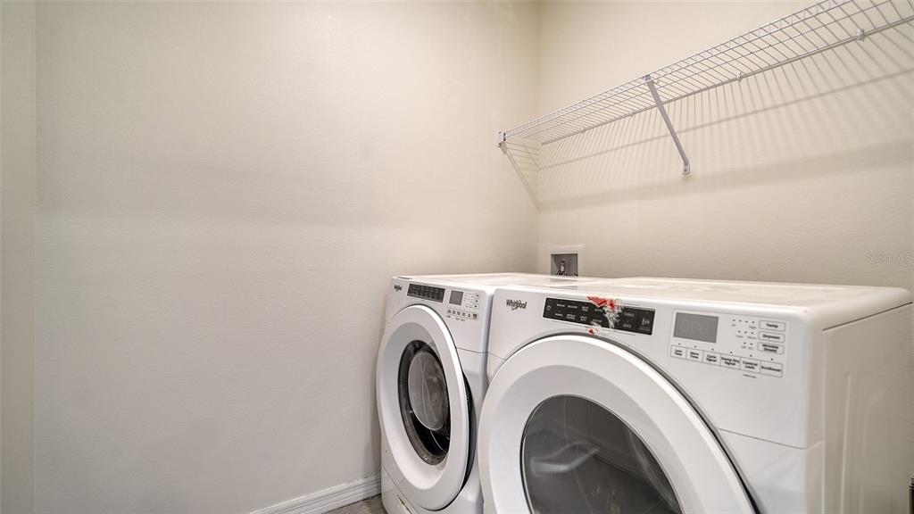 12732 Lateral Root Drive Sarasota, FL 34238 - Photo 22 of 76 a utility room with dryer and washer