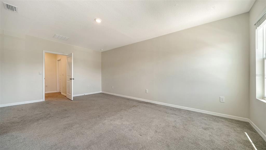12732 Lateral Root Drive Sarasota, FL 34238 - Photo 25 of 76 an empty room with an entryway