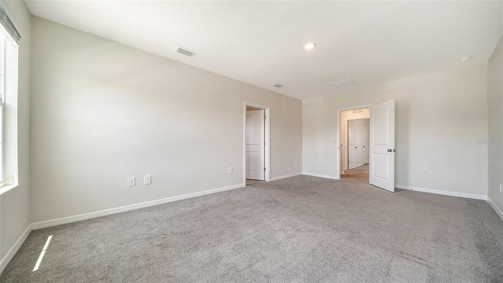 12732 Lateral Root Drive Sarasota, FL 34238 - Photo 26 of 76 an empty room with an entryway