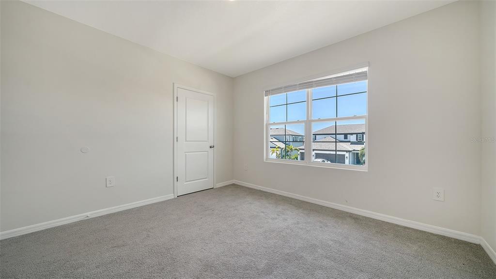 12732 Lateral Root Drive Sarasota, FL 34238 - Photo 40 of 76 an empty room with windows