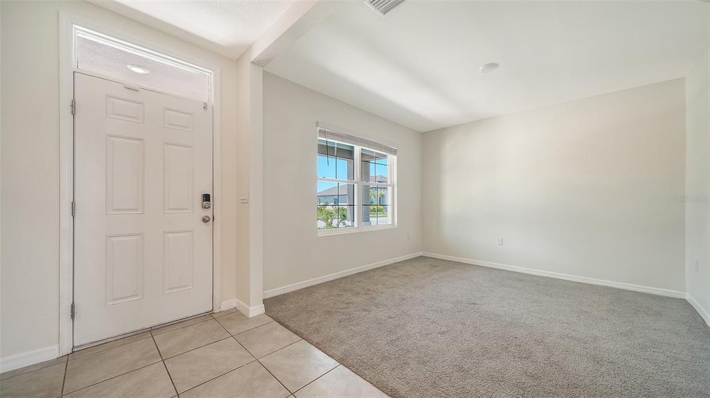 12732 Lateral Root Drive Sarasota, FL 34238 - Photo 4 of 76 a view of an empty room with window