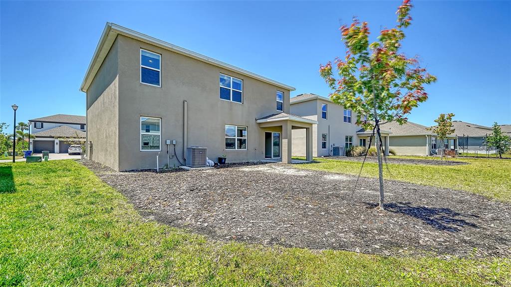 12732 Lateral Root Drive Sarasota, FL 34238 - Photo 44 of 76 a house view with a garden space
