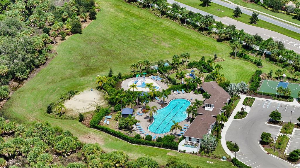 12732 Lateral Root Drive Sarasota, FL 34238 - Photo 47 of 76 an aerial view of a house with a yard and lake view