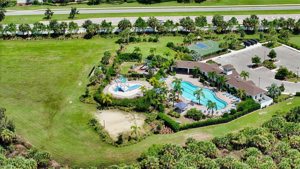 12732 Lateral Root Drive Sarasota, FL 34238 - Photo 48 of 76 a view of a garden with a lake
