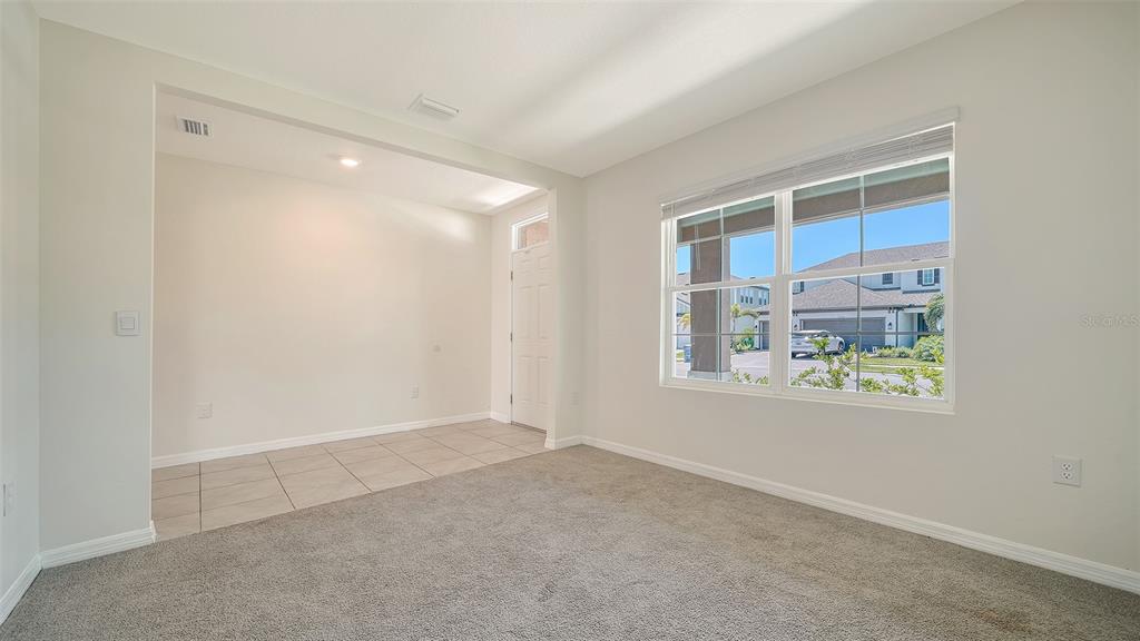 12732 Lateral Root Drive Sarasota, FL 34238 - Photo 6 of 76 a view of an empty room with a window