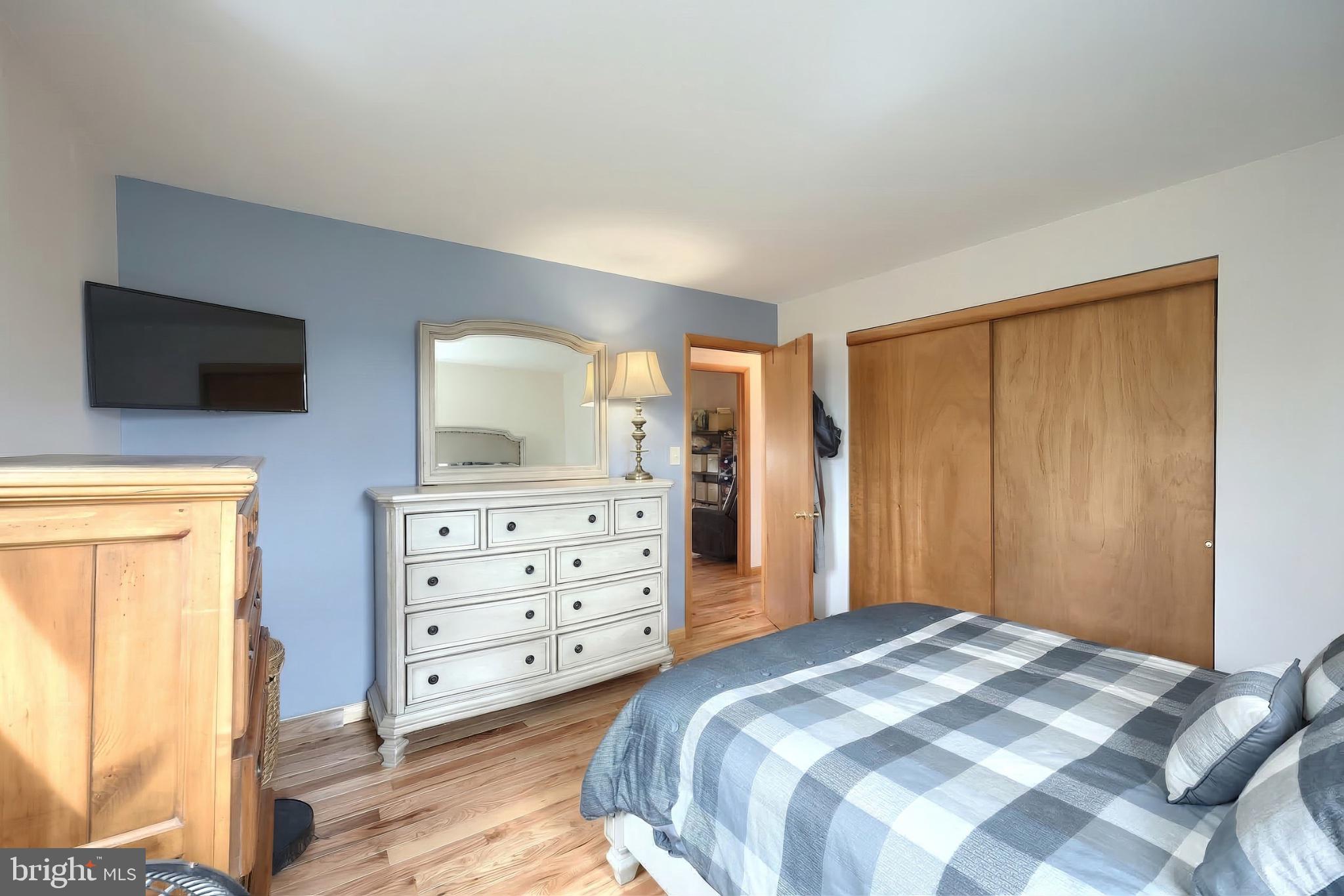 1766 Baltimore Road York Springs, PA 17372 - Photo 19 of 52 Serene bedroom with warm wood accents.