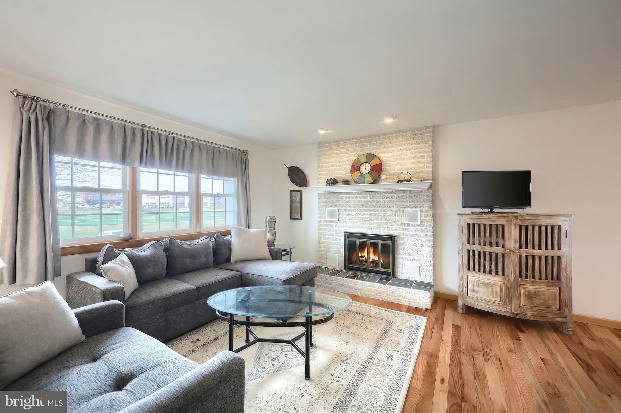 1766 Baltimore Road York Springs, PA 17372 - Photo 3 of 52 Cozy living space with a warm fireplace.