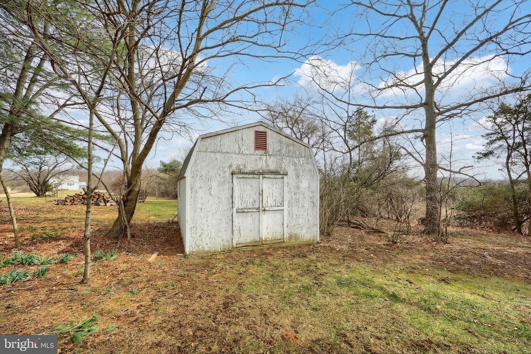 1766 Baltimore Road York Springs, PA 17372 - Photo 41 of 52 Charming shed nestled in nature's embrace.