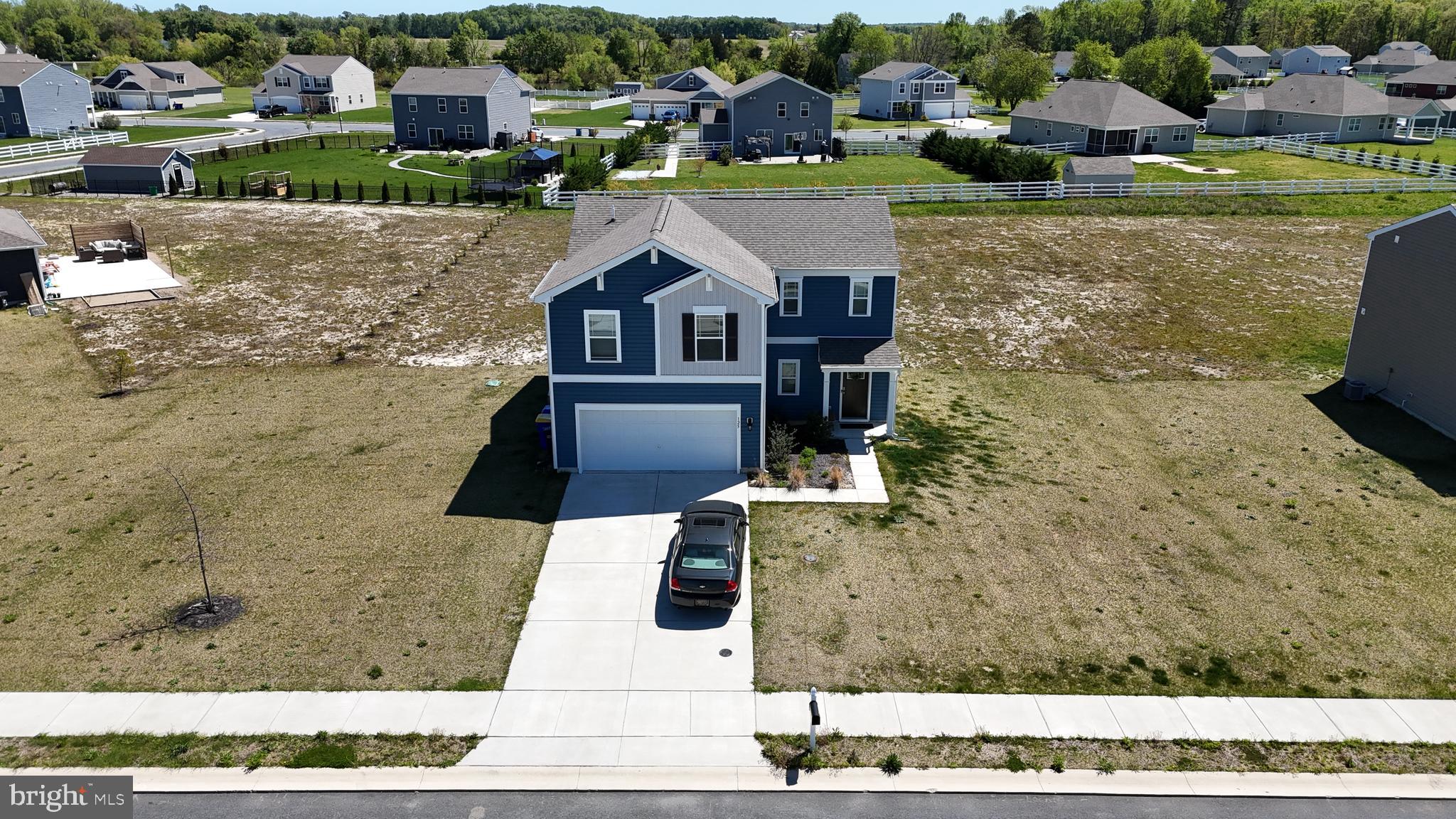 a aerial view of a house with outdoor space