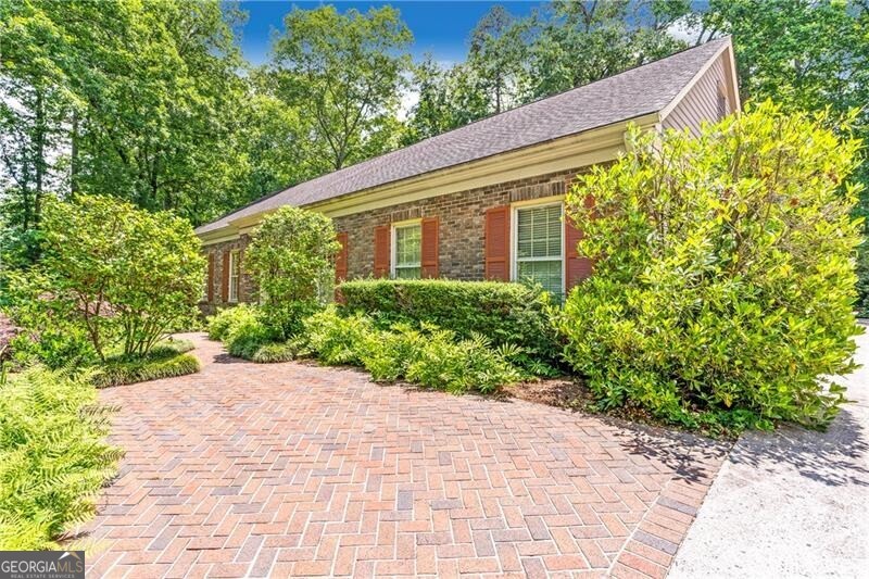 a backyard of a house with lots of green space