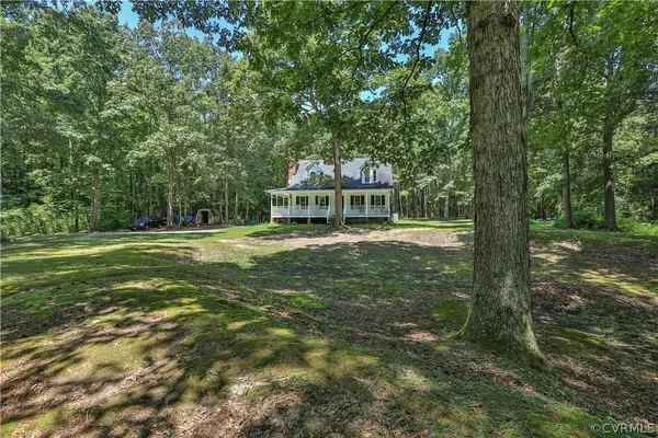 a view of a house with a big yard