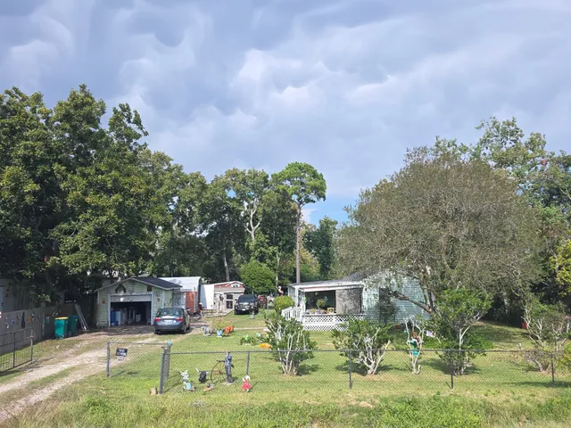 a balcony with furniture and a garden