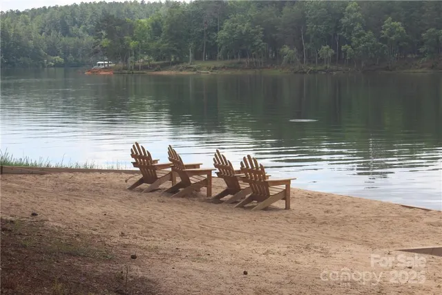 a view of a lake with outdoor seating