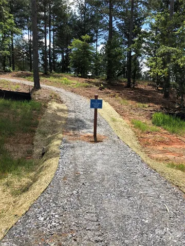 a view of a yard with swimming pool