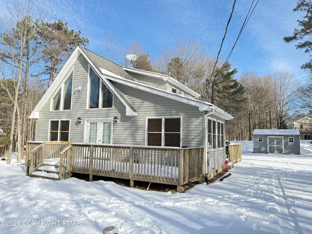 a living room with furniture a fireplace and a table