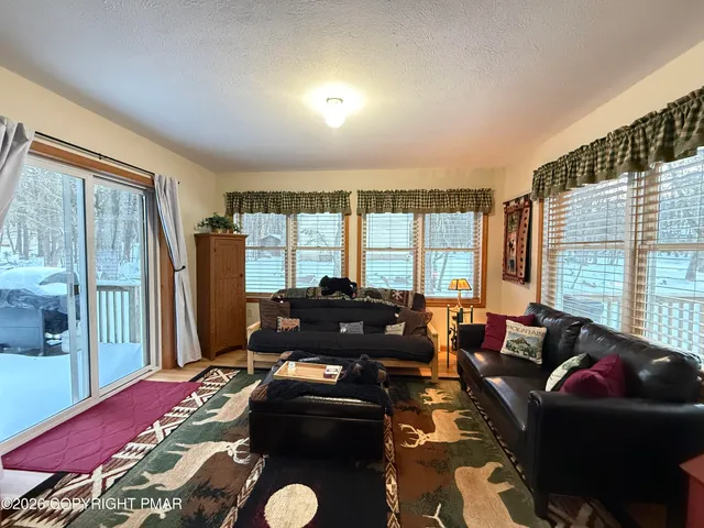 a bedroom with a bed and a lamp on table