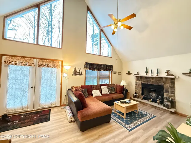 a living room with furniture a rug and a chandelier