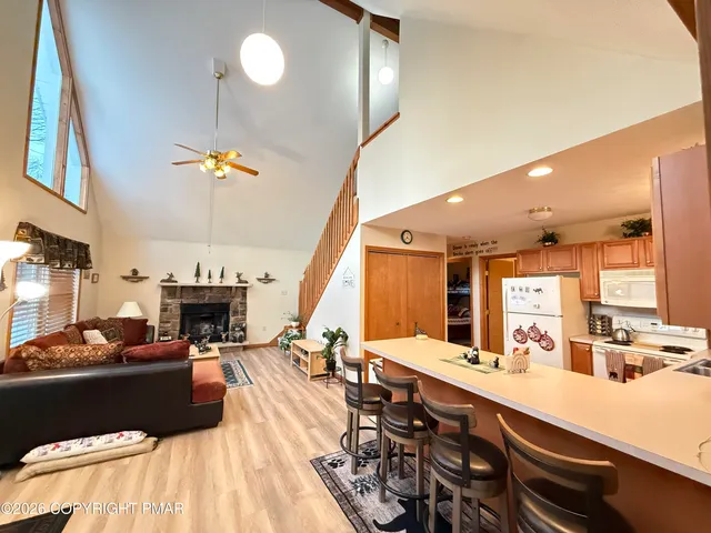 a bedroom with a bed and a flat tv screen on dresser
