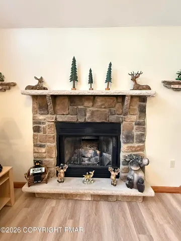 a kitchen with a refrigerator and a stove top oven