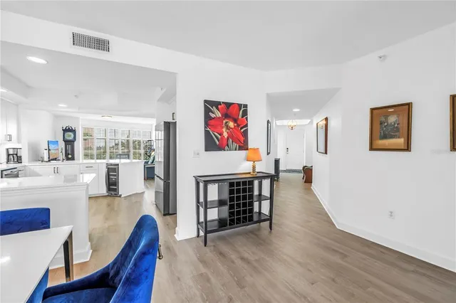 a view of a dining room with furniture wooden floor and a rug