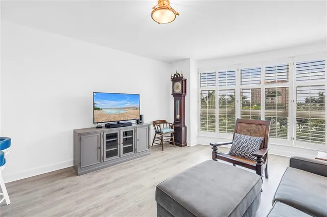 a view of a dining room with furniture wooden floor and a chandelier