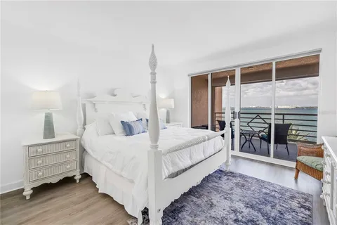 a bed room with a bed and a night stand