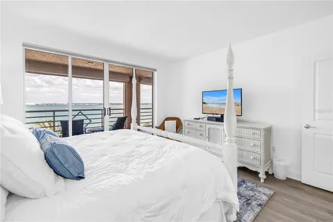 a bathroom with a double vanity sink toilet and shower