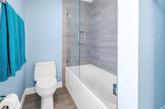 a view of a swimming pool with an outdoor seating and a yard