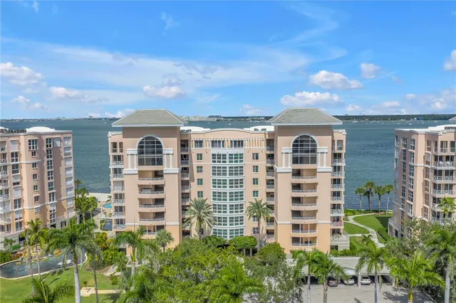 a view of a backyard with plants and a lake
